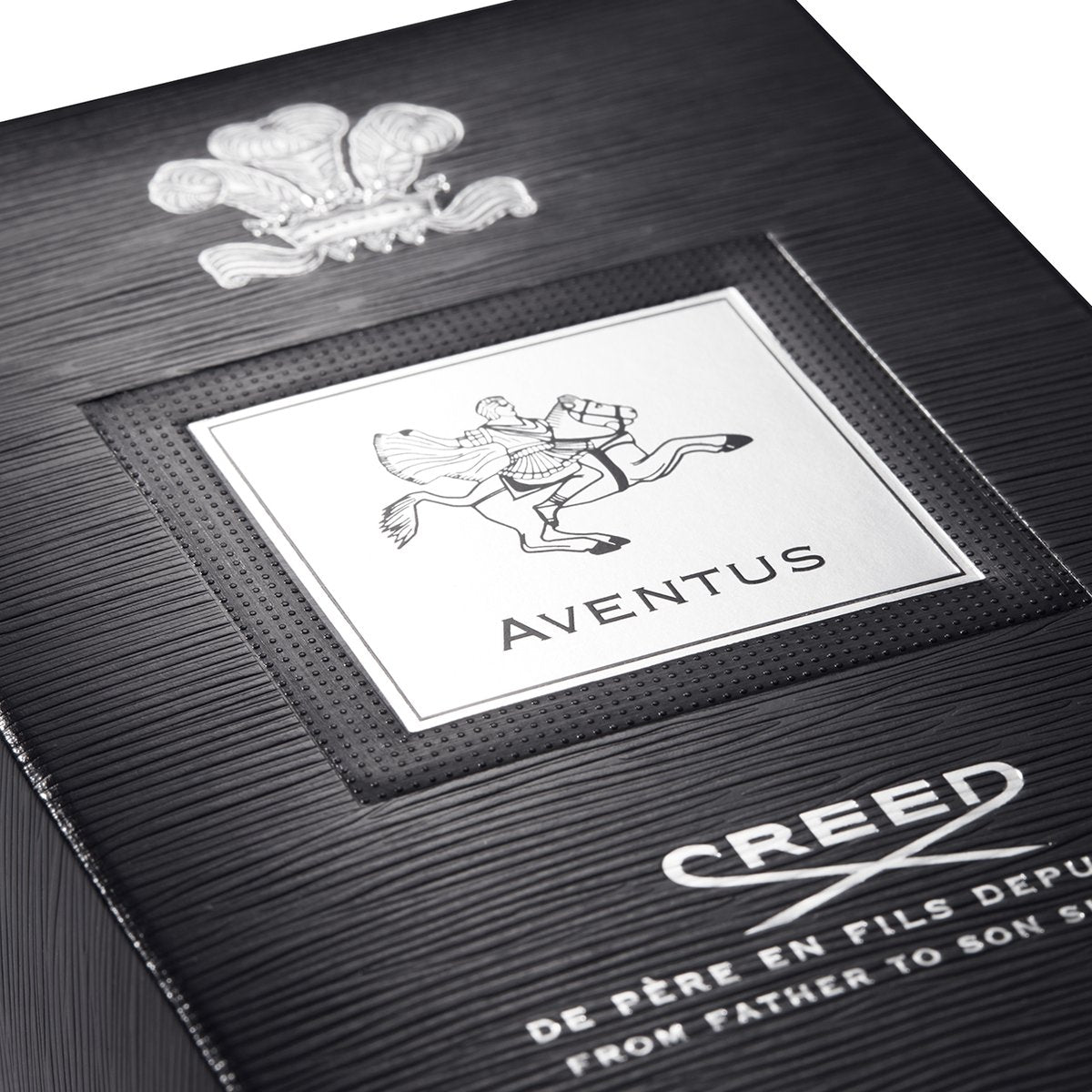 Close-up of a Creed Aventus perfume box with branding and design details. The Style Hub
